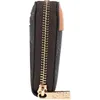 Side view of a brown wallet with a gold zipper. Anteprima dell’immagine prodotto