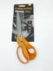 A pair of orange Fiskars Classic fabric scissors in its original packaging, displayed against a white background. Podgląd zdjęcia produktu