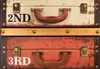 A close-up view of two stacked vintage-style suitcases. Podgląd zdjęcia produktu