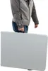 A person is holding a folded table. Podgląd zdjęcia produktu