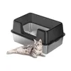 A cat is lying in front of a litter box. Voir les images du produit