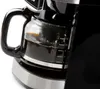 A close-up shot of a coffee maker's carafe filled with coffee. Podgląd zdjęcia produktu