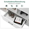 Close-up view of an open drawer in a white furniture piece, showing storage items and a book. Náhľad obrázku produktu