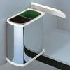 A dual-compartment trash can with a chrome finish, mounted inside a cabinet. Produktbild-Vorschau