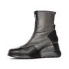 A studio shot of a single boot against a white background. Náhled obrázku produktu