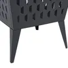 A close-up view of the legs and lower portion of a black metal fire pit with a diamond-patterned cutout. Náhled obrázku produktu