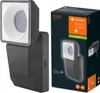 A product image showing a dark gray LED floodlight with a motion sensor next to its retail packaging. Produktbild-Vorschau