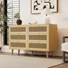 A wooden dresser with rattan woven drawer fronts sits in a well-lit room, next to a window and a piece of abstract art. Anteprima dell’immagine prodotto