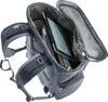 A close-up view of the inside of a backpack, showing a tablet and books. Voir les images du produit