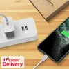 A white charging brick with two USB ports and a phone being charged by a USB-C cable. Produktbild-Vorschau