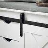 A close-up view of a white storage bench with a black sliding barn door mechanism. Anteprima dell’immagine prodotto