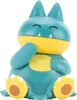 A teal and yellow Pokemon figurine sitting down with its hand near its mouth. Anteprima dell’immagine prodotto