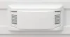 Close-up of a white ventilation grille on a white appliance. Anteprima dell’immagine prodotto