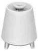A white conical speaker with a silver top and three silver legs. Produktbild-Vorschau