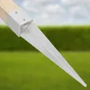 A close-up of a metal ground spike attached to a wooden post, set against a blurred background of green grass and a blue sky with clouds. Produktbild-Vorschau