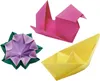 Three origami figures: a pink bird, a purple and green flower, and a yellow boat, arranged on a white background. Voir les images du produit