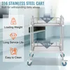 A stainless steel rolling cart with two shelves, shown in a room with cabinets and curtains in the background. Text overlays highlight features and specifications. Produktbild-Vorschau