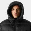 Close-up of a man wearing a black puffer jacket with the hood up. Voir les images du produit