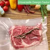 A vacuum-sealed steak with herbs, surrounded by fresh ingredients like tomatoes, peppers, garlic, and onions on a wooden surface. Produktbild-Vorschau