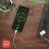 A Huawei smartphone is charging on a wooden table next to a power strip. Produktbild-Vorschau