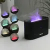 A black aroma diffuser with a flame-like mist effect, shown with multiple circular insets displaying different mist colors. Voir les images du produit