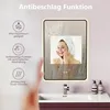 A bathroom scene with a mirror, sink, and toiletries. Anteprima dell’immagine prodotto