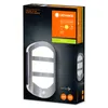 The image shows the packaging of an outdoor wall light with a sensor. The packaging is dark with a prominent image of the light fixture and branding information. Podgląd zdjęcia produktu