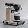 A Moccacmaster Cup-One coffee maker is shown on a white surface against a white background. Produktbild-Vorschau