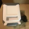 A white and gray trash can is placed on a brown couch. Náhľad obrázku produktu
