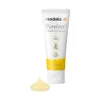 A tube of Medela PureLan Lanolin cream with a dollop of cream in front of it. Náhled obrázku produktu