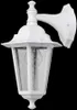A white outdoor wall lamp with a glass enclosure and a visible light bulb, set against a black background. Náhľad obrázku produktu