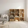 A living room scene with a sofa and a wooden crate shelving unit. Náhled obrázku produktu