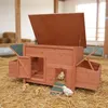 A wooden chicken coop with nesting boxes and a run, set on a bed of straw with several chicks around it. Náhled obrázku produktu