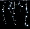 Icicle lights hanging against a black background. Anteprima dell’immagine prodotto