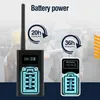 Two people in a factory setting, one holding a black device with an antenna, and another holding a smaller white device. Both devices have battery indicators and text. Produktbild-Vorschau