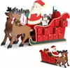 A wooden Christmas advent calendar shaped like Santa's sleigh pulled by reindeer, with numbered drawers. Anteprima dell’immagine prodotto
