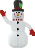 An inflatable snowman with a black top hat and red mittens, waving. Voir les images du produit