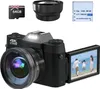 A digital camera with accessories, including a memory card, lens, and battery, displayed on a white background. The camera's screen shows a family on a beach. Produktbild-Vorschau