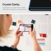 A person is holding a smartphone and taking a picture of a wall with papers and color swatches. Anteprima dell’immagine prodotto