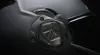A close-up shot of a dark gray motorcycle helmet, focusing on the side mechanism and logo. Voir les images du produit
