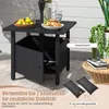 An outdoor table with a storage compartment, set up on a patio with some items on top and sandbags nearby. Podgląd zdjęcia produktu