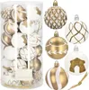 A collection of gold and white Christmas ornaments in a clear plastic container and arranged around it. Anteprima dell’immagine prodotto