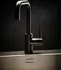 A close-up studio shot of a modern stainless steel kitchen faucet. Produktbild-Vorschau