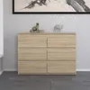 A modern, griffless dresser with six drawers in an Eiche Sonoma finish, set against a textured wallpaper and a dark tiled floor. Produktbild-Vorschau