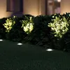 Ground lights illuminating a hedge at night. Produktbild-Vorschau