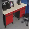 A workbench with red drawers and a light wood top, with several containers on top. A stool is to the right. Produktbild-Vorschau