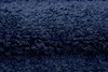 A close-up view of a dark blue shaggy rug. Anteprima dell’immagine prodotto