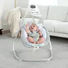 A baby is sitting in a baby swing in a living room. Produktbild-Vorschau