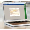 A laptop displaying a form on its screen. Náhled obrázku produktu