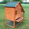 A wooden chicken coop with a run is shown outdoors on a grassy lawn. Produktbild-Vorschau